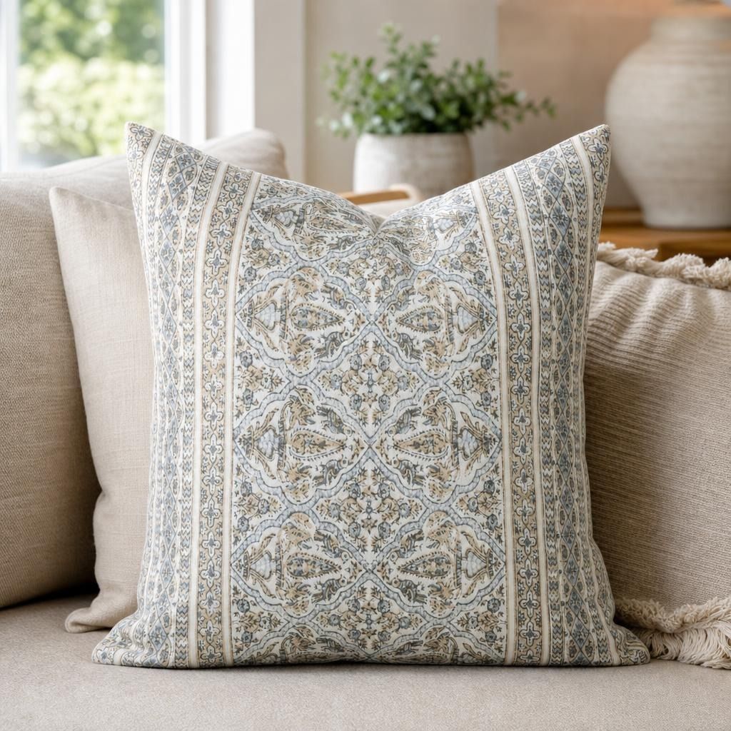 Close-up of Athena pillow cover showing intricate medallion pattern in blue, beige, and taupe, highlighting fabric texture and craftsmanship.