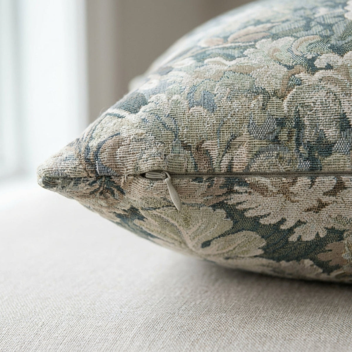 Detailed shot of the pillow cover’s invisible zipper and stitching, showcasing high craftsmanship and fabric quality.