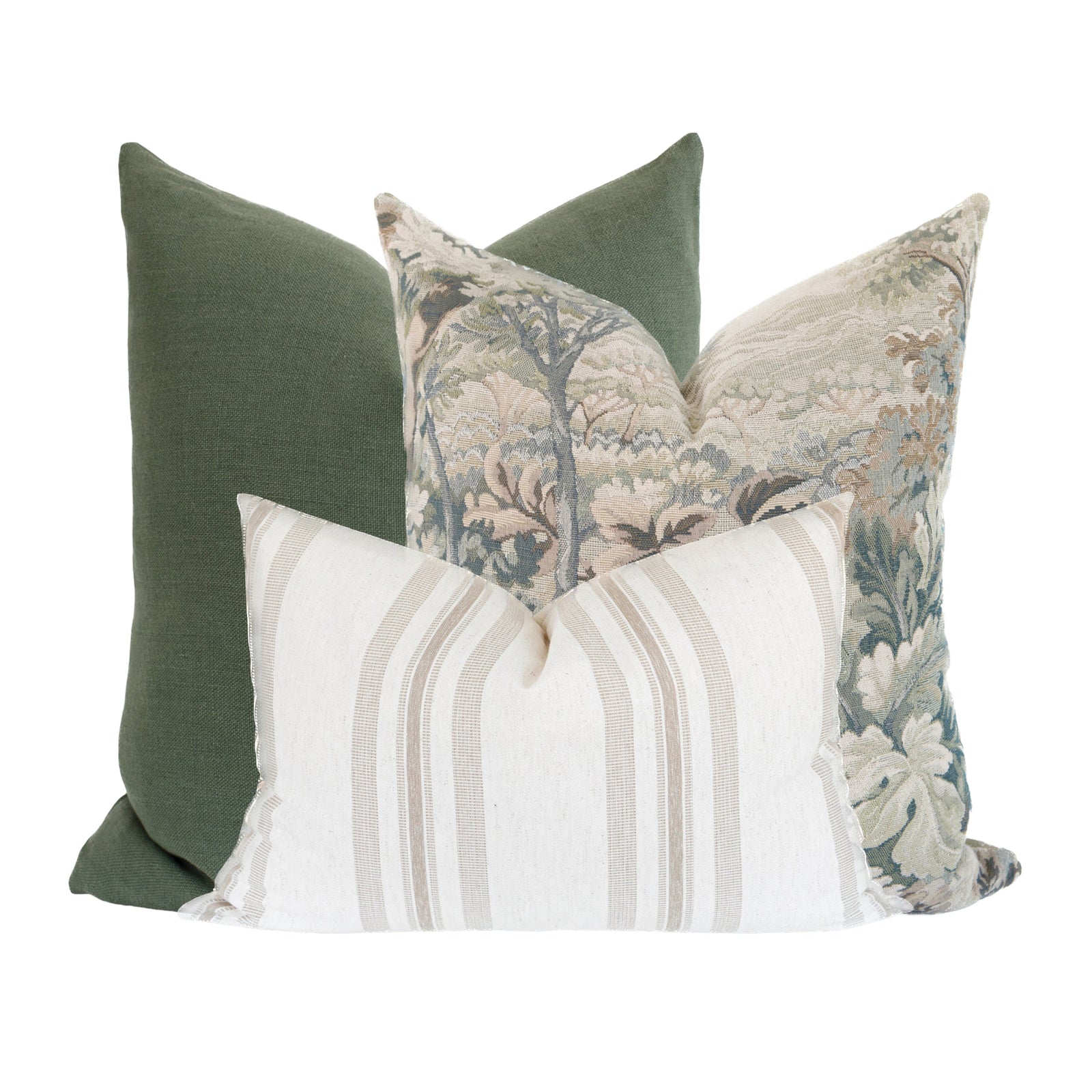 Full-body view of Callahan pillows arranged on a neutral linen sofa in a bright, cozy living room, highlighting size, texture, and hidden zippers.