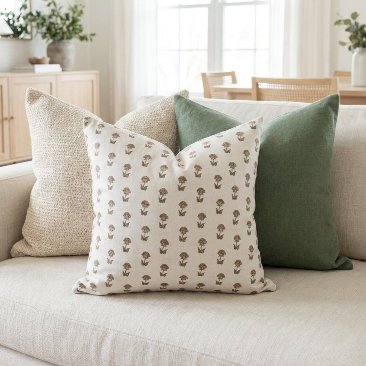 Close-up of Single-Sided Combo 2 pillow covers on a neutral-toned sofa, highlighting crisp edges, micro-texture, and floral patterns.