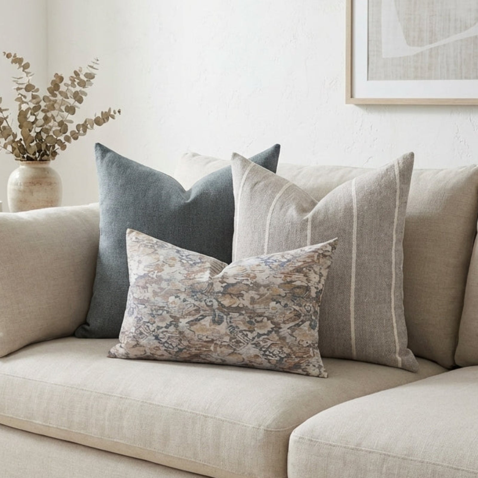 Gage Sofa Combo 3 pillows arranged on a neutral, airy sofa in a cozy living space, highlighting textures, fabric details, and zipper features.