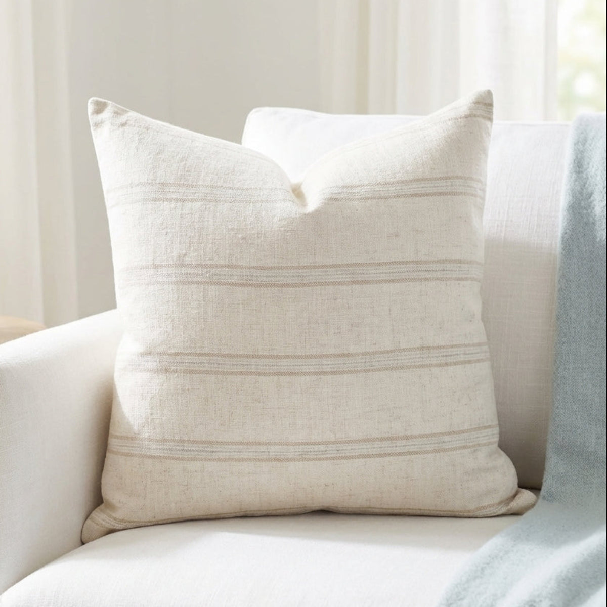 Elegant scene of Marlow Pillow Cover on a bed in a modern bedroom with soft daylight lighting, emphasizing fabric softness and subtle micro-textures.