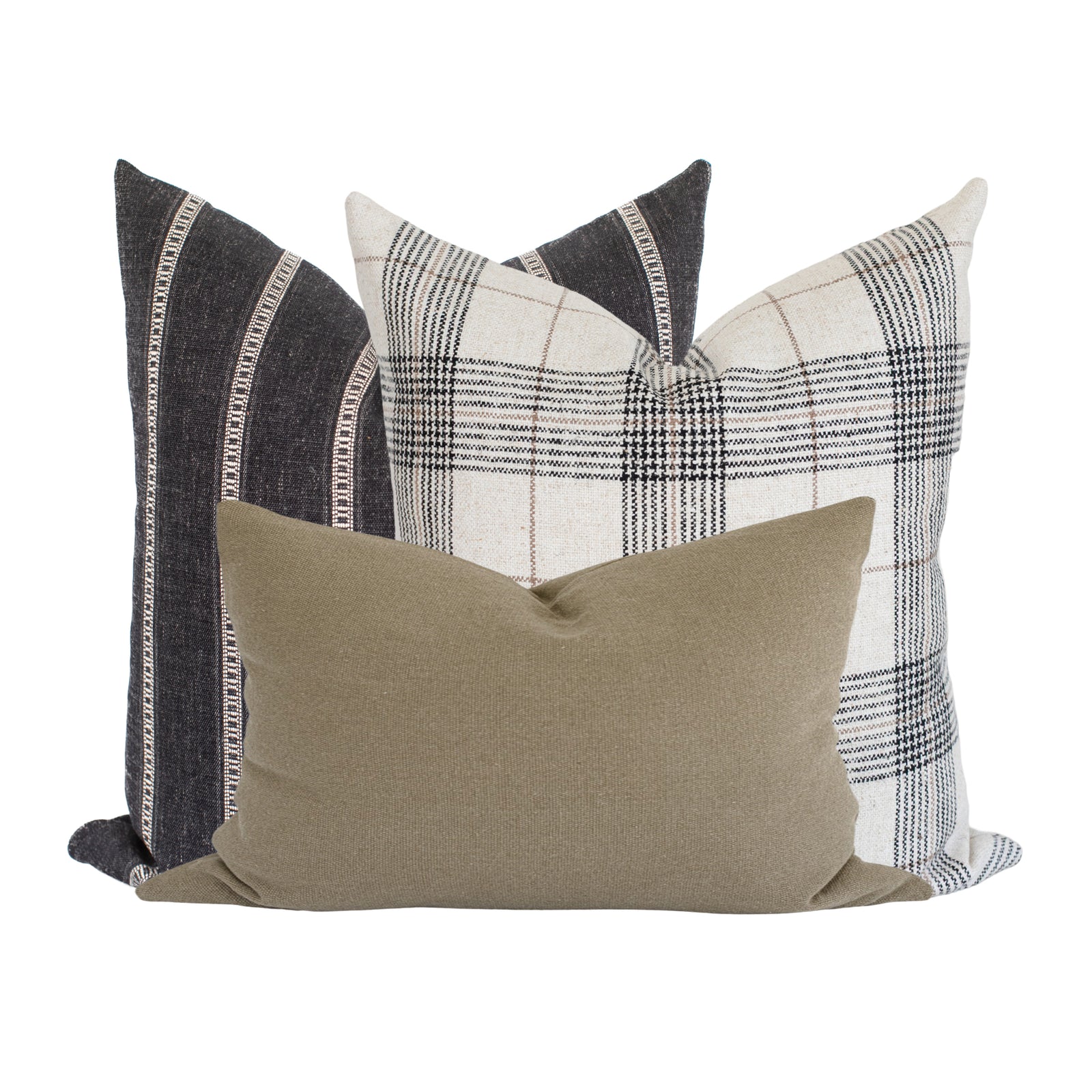 Arrangement of Monroe Sofa Combo 2 pillows on a neutral-toned sofa in a spacious airy living room with natural light, highlighting textures and handcrafted details.