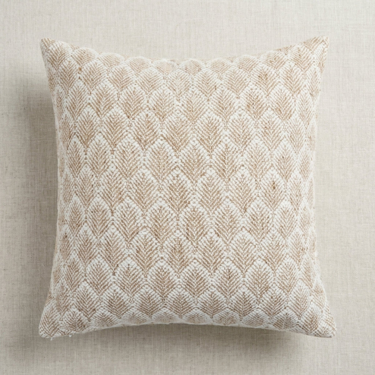 Styled flat lay of the Whitaker Pillow Cover on a neutral surface, capturing detailed weave, pattern, and craftsmanship with soft lighting.