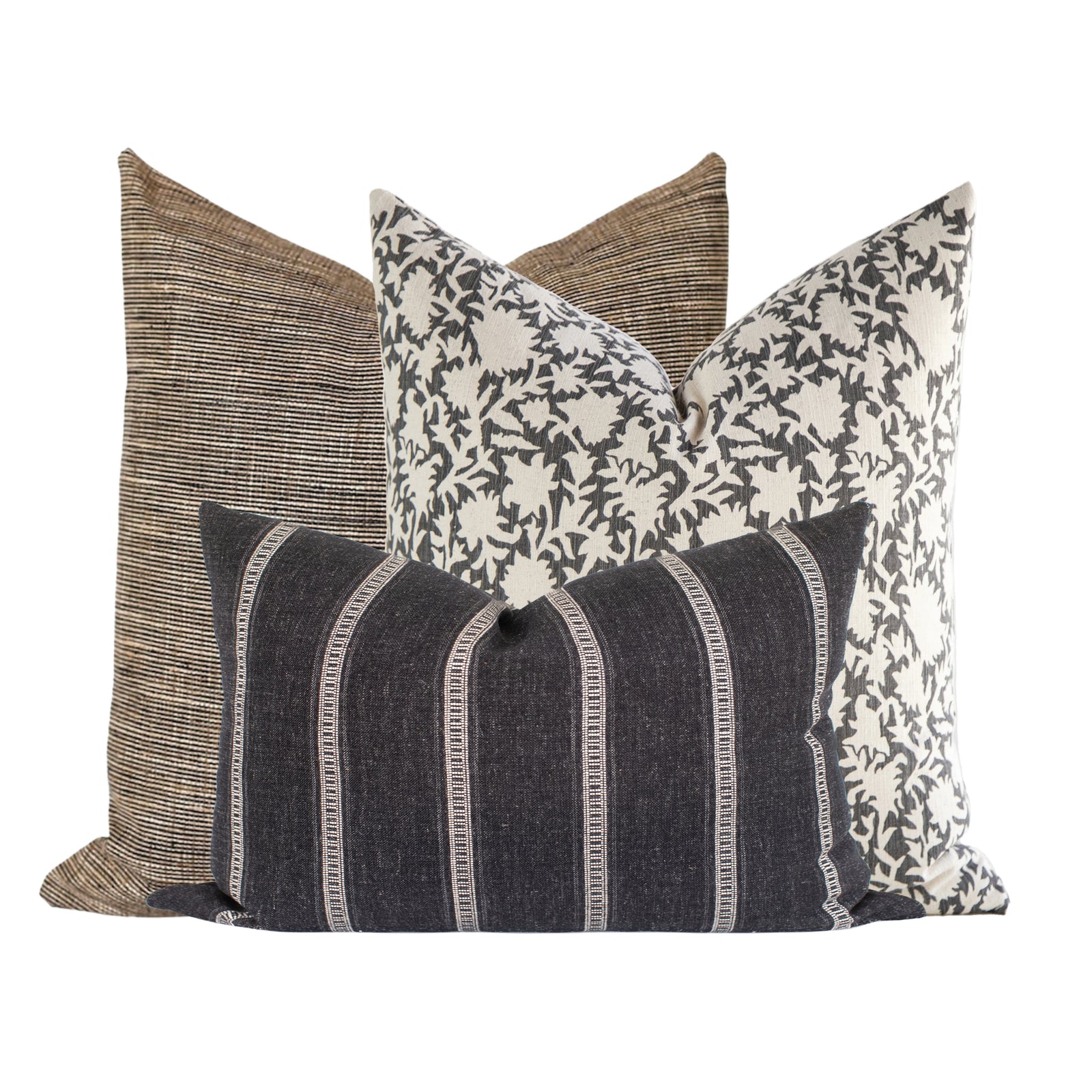 Photorealistic scene of Xavier Sofa Combo 4 pillows arranged on a neutral-toned airy sofa in a minimalistic, softly lit living room, highlighting textures and botanical motifs.