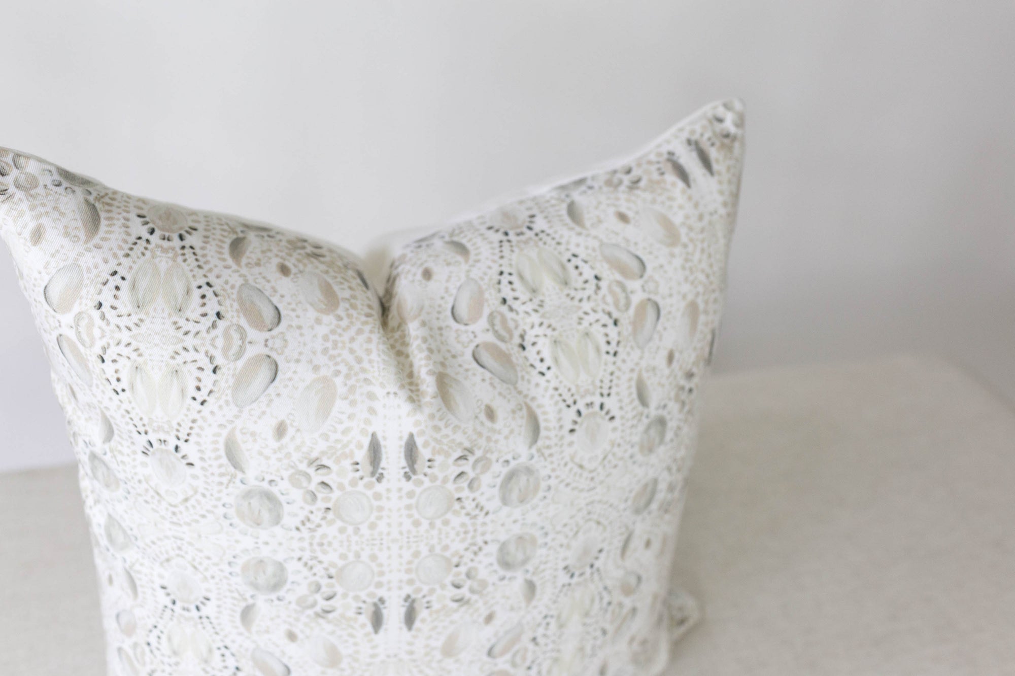 white and grey pillow cover